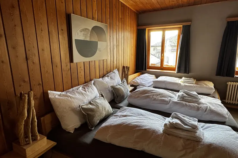 The Zürich room: a triple room on the corner, with a view over the village.